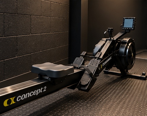 Rowing machine against the black studio backdrop